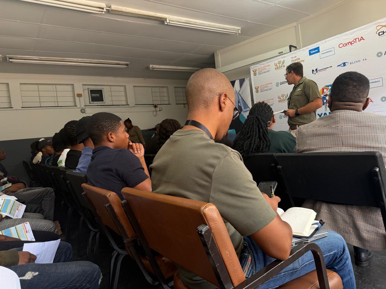Founders listening to a speaker at the pitch and presentation day